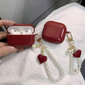 Funda Protectora Elegante Red Velvet con Llavero de Perlas y Corazón